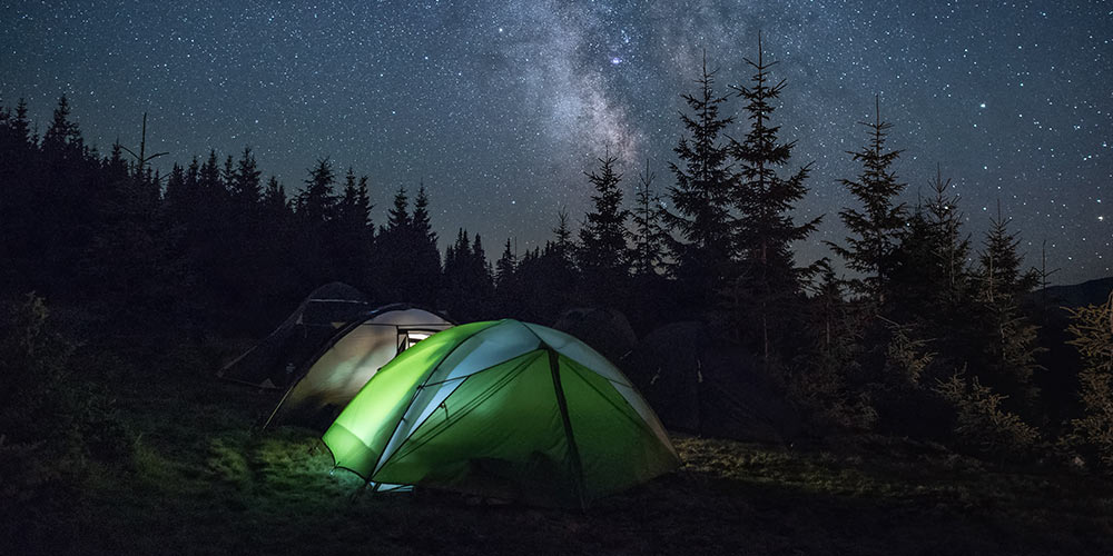 camping tent set up in Texas state  park under Milky Way