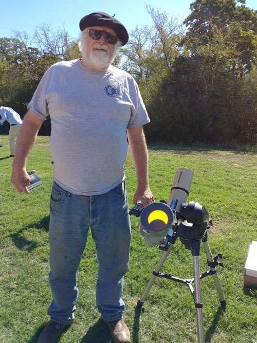 Tim Cowden with eclipse on display