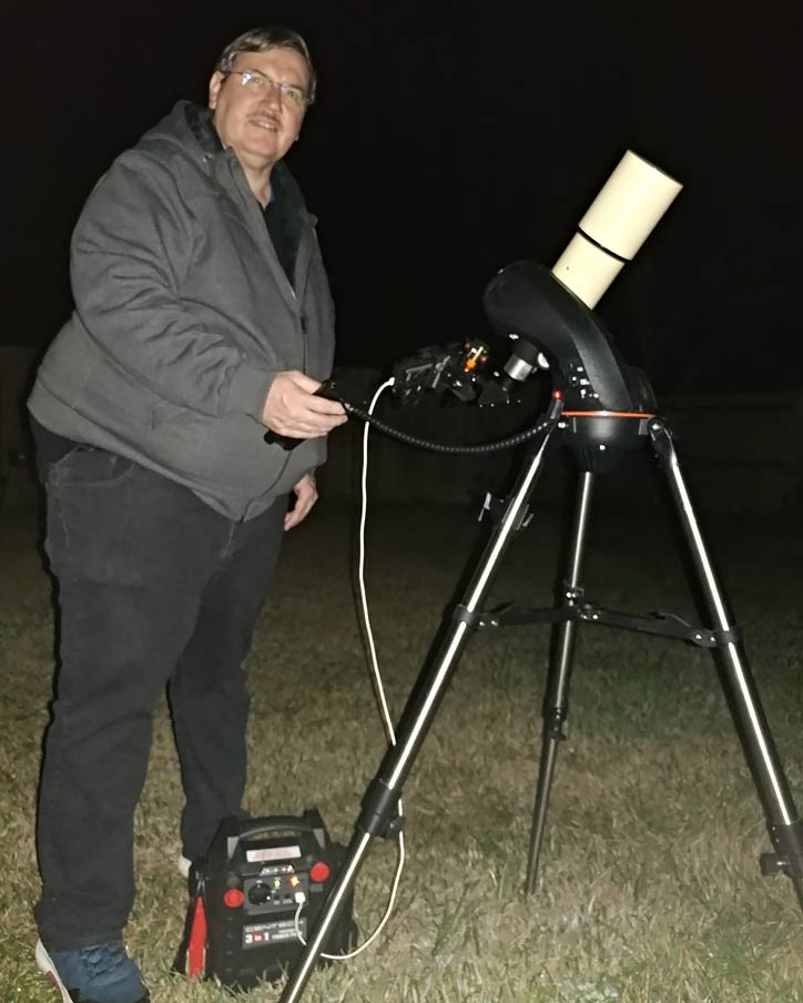 Campbell and smart phone mounted on a telescope