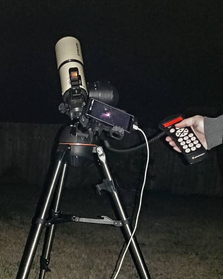 mobile phone mounted on a telescope